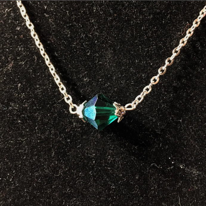 Another seller's version with a blue-tinted bead